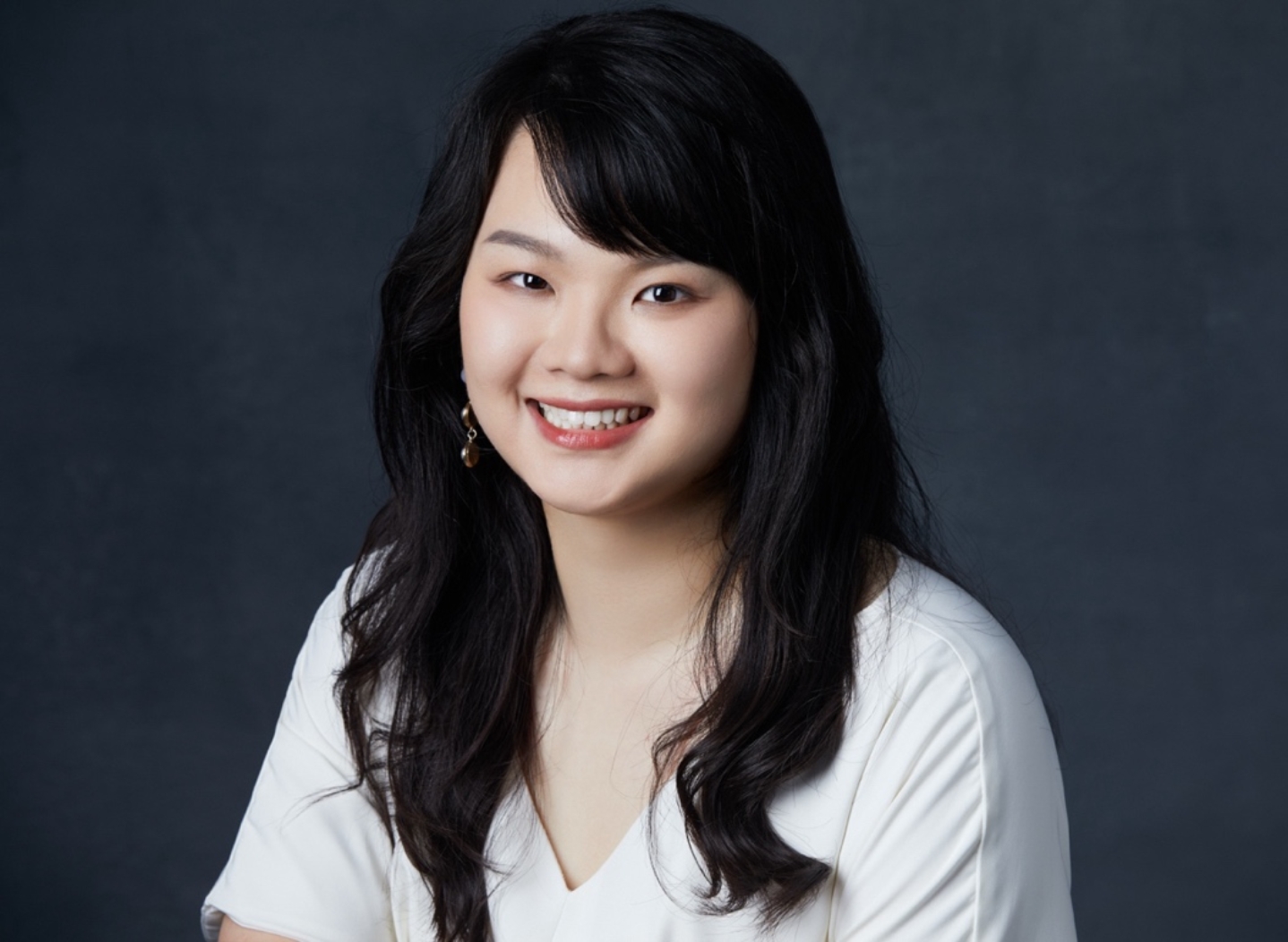 A person with long black hair smiling
AI-generated content may be incorrect.